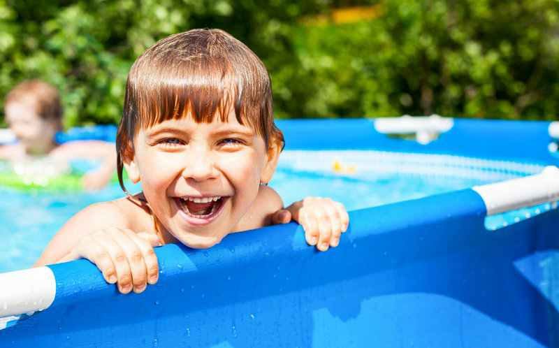 Child laughing in a swimming pool